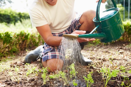 Segregated garden waste bins and recycling containers on site